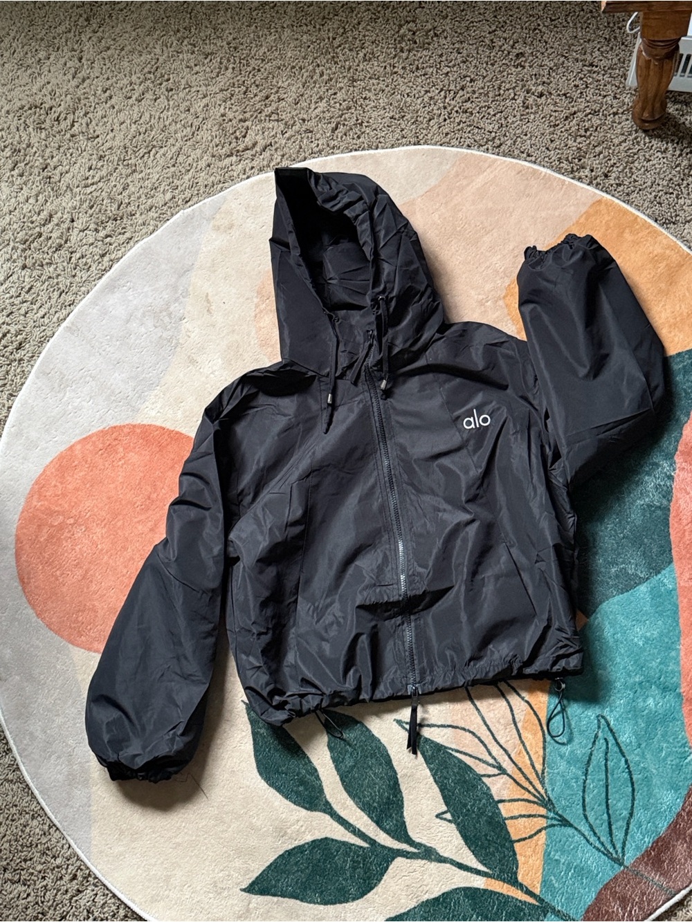 Black jacket with embroidered white 3 letters